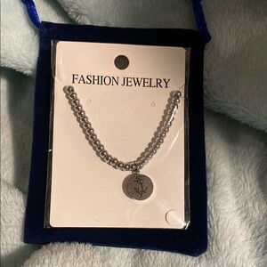 Silver Beaded Bracelet with Floral Charm